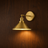 Blid adjustable vintage brass wall light on a wall, NOGAN Lights
