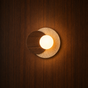 Runa Scandinavian travertine and wood wall light on a wood wall — NOGAN Lights