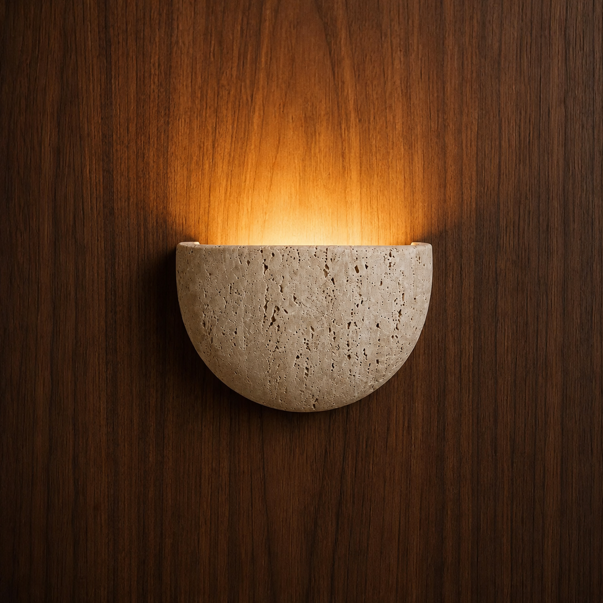 Vidde half-moon travertine wall light on a wood-panelled wall — NOGAN Lights