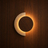 Orane designer travertine and wood LED wall light on a wood wall, NOGAN Lights