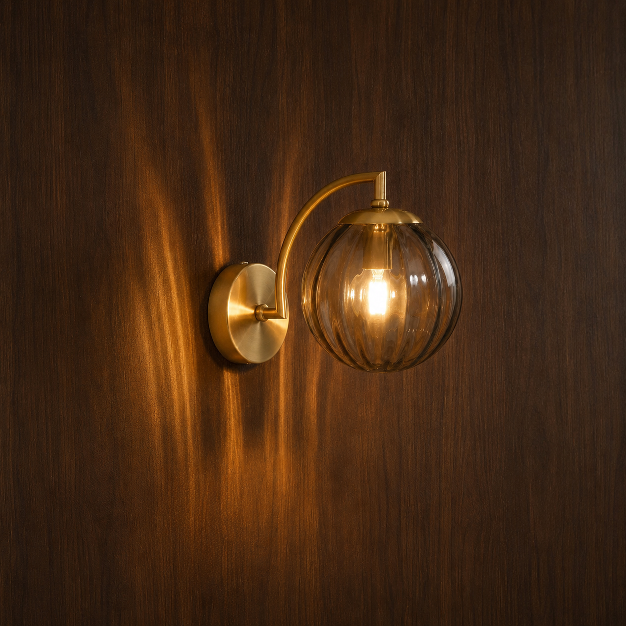 Lykta gold glass and metal designer wall light on a wall, NOGAN Lights