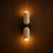 Aften Scandinavian travertine and solid wood wall light on a wood wall, NOGAN Lights