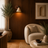 Travertine and wood wall light casting a warm glow in a modern Nordic room