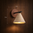 Scandinavian wall light dimensions shown against a wood wall