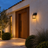 Retro outdoor wall light casting a warm glow beside a front door