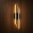 Utu modern designer LED wall light on a wood wall, NOGAN Lights