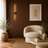 Minimalist LED wall light casting a warm glow in a modern living room
