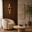 Modern LED wall light casting a warm glow in a contemporary living room