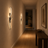 Contemporary LED wall light casting a warm glow in a modern living room