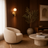 Gold designer wall light casting a warm glow in a modern living room