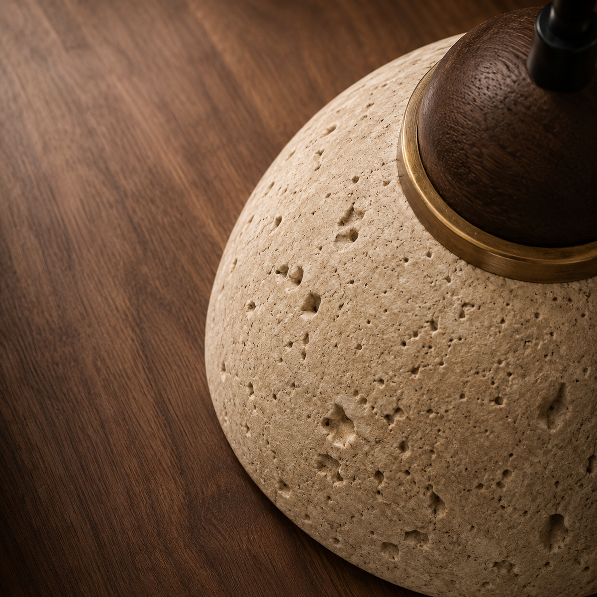 Close-up of travertine and wood detail on the Eira wall light