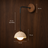 Modern wall light dimensions shown against a wood wall