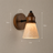 Almo Scandinavian wall light styled in a cosy living room