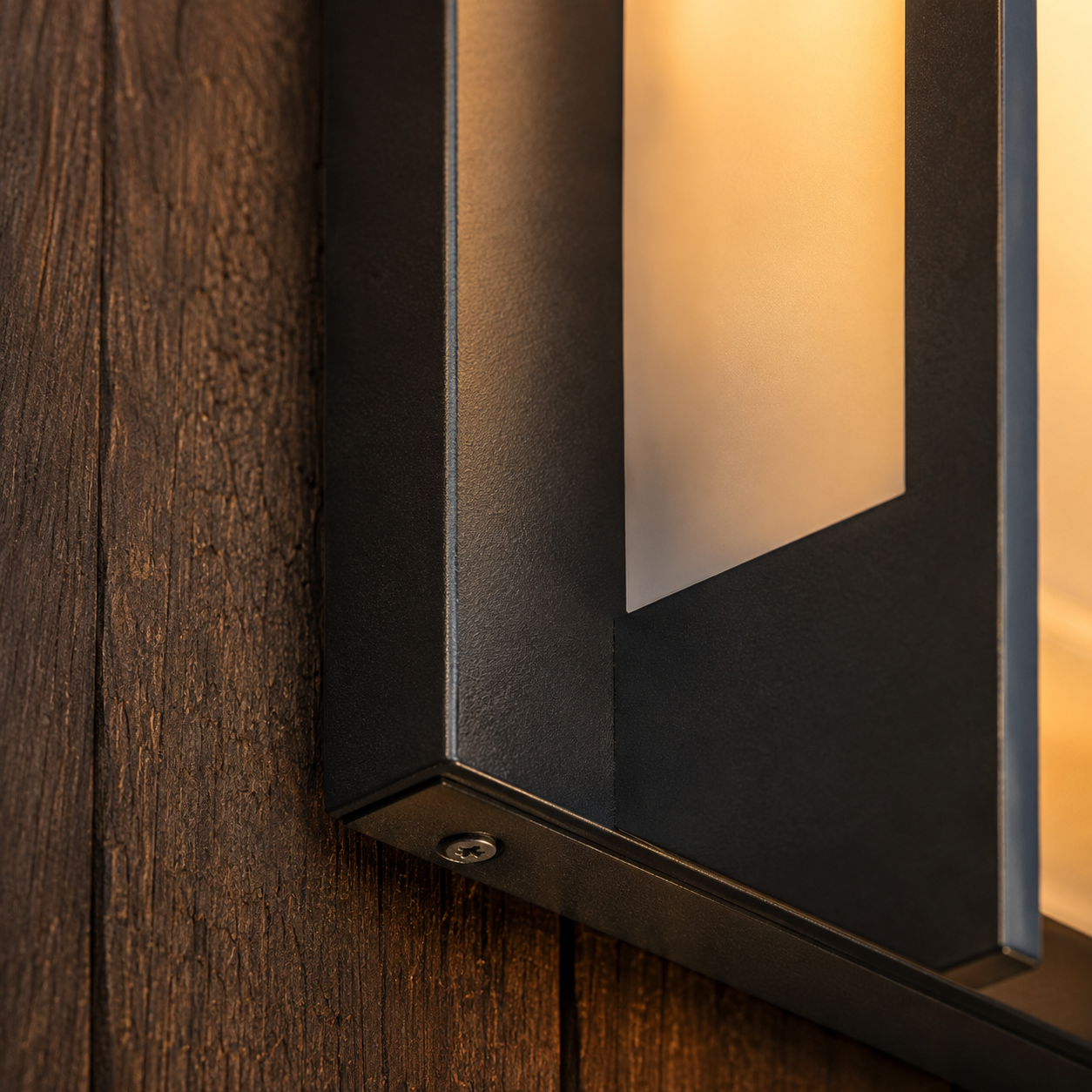Kyst outdoor wall light lighting a pathway in the evening