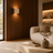 Scandinavian travertine wall light casting a warm ambient glow in a modern room