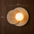 Scandinavian wall light dimensions shown against a wood wall