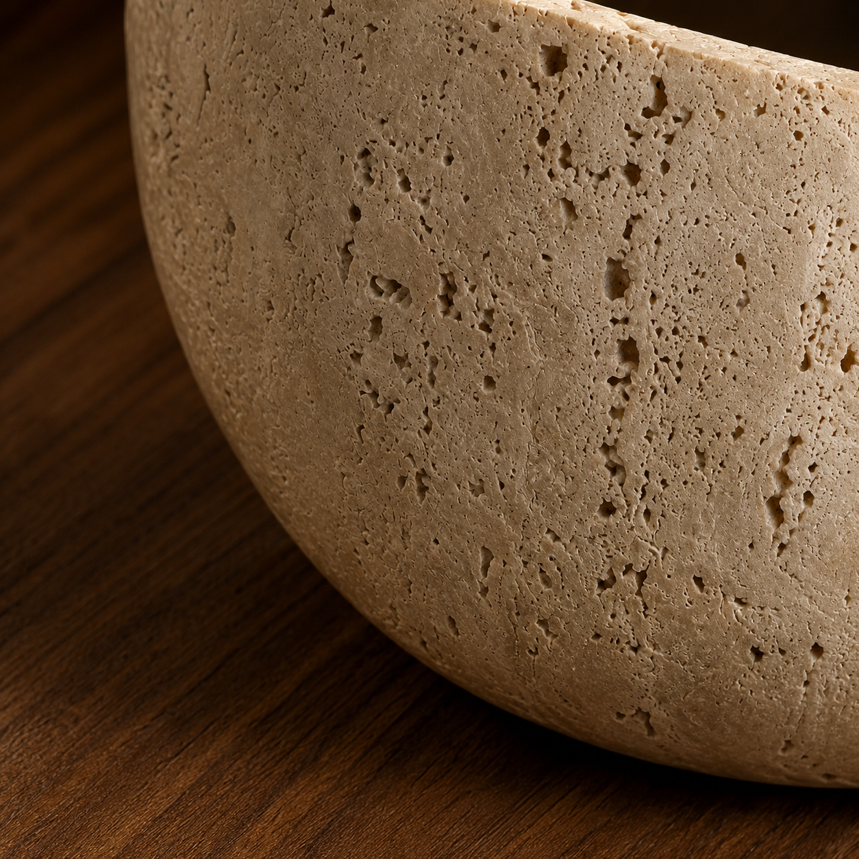 Vidde sculptural travertine wall light styled in a cosy living room