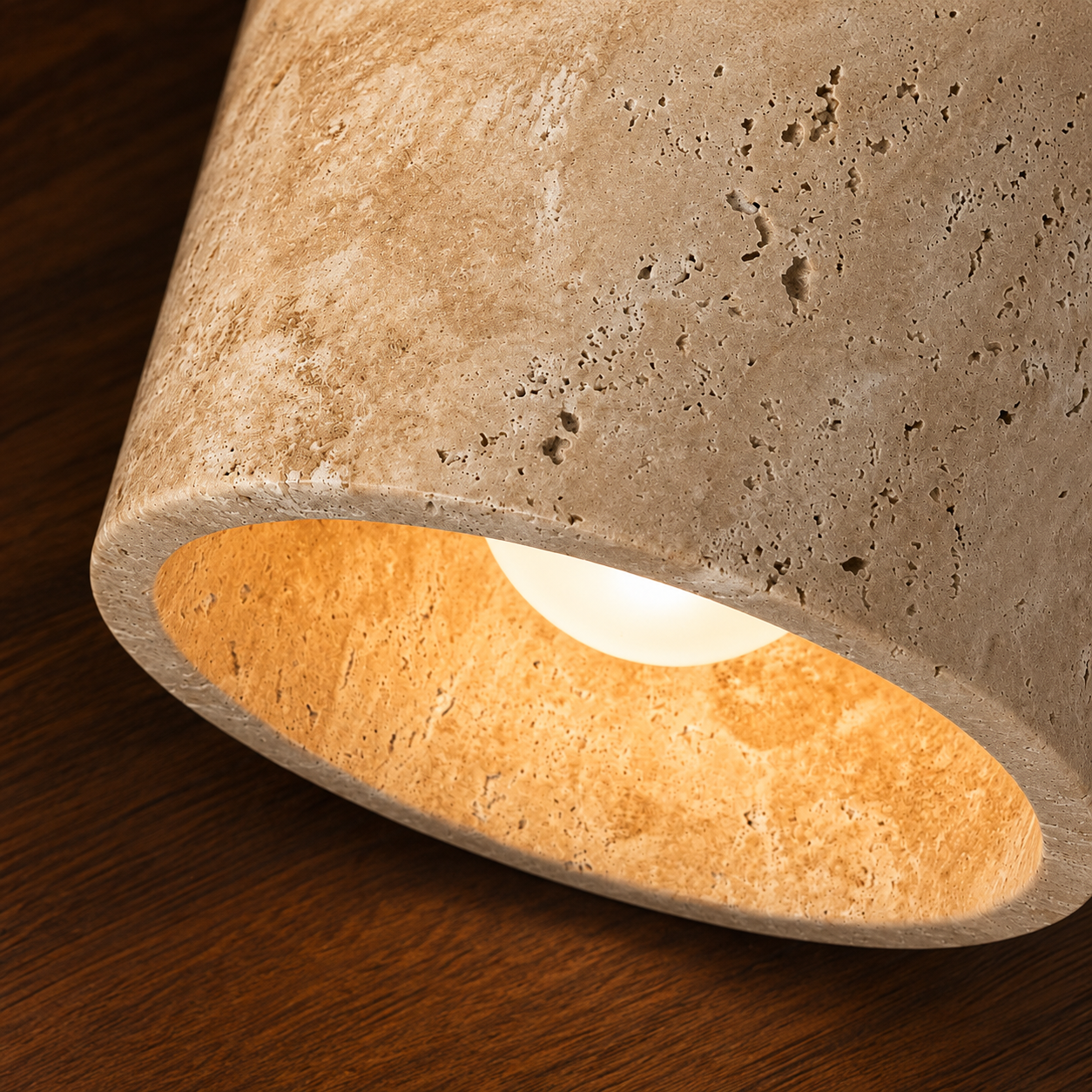 Close-up of travertine and wood detail on the Kaiho wall light