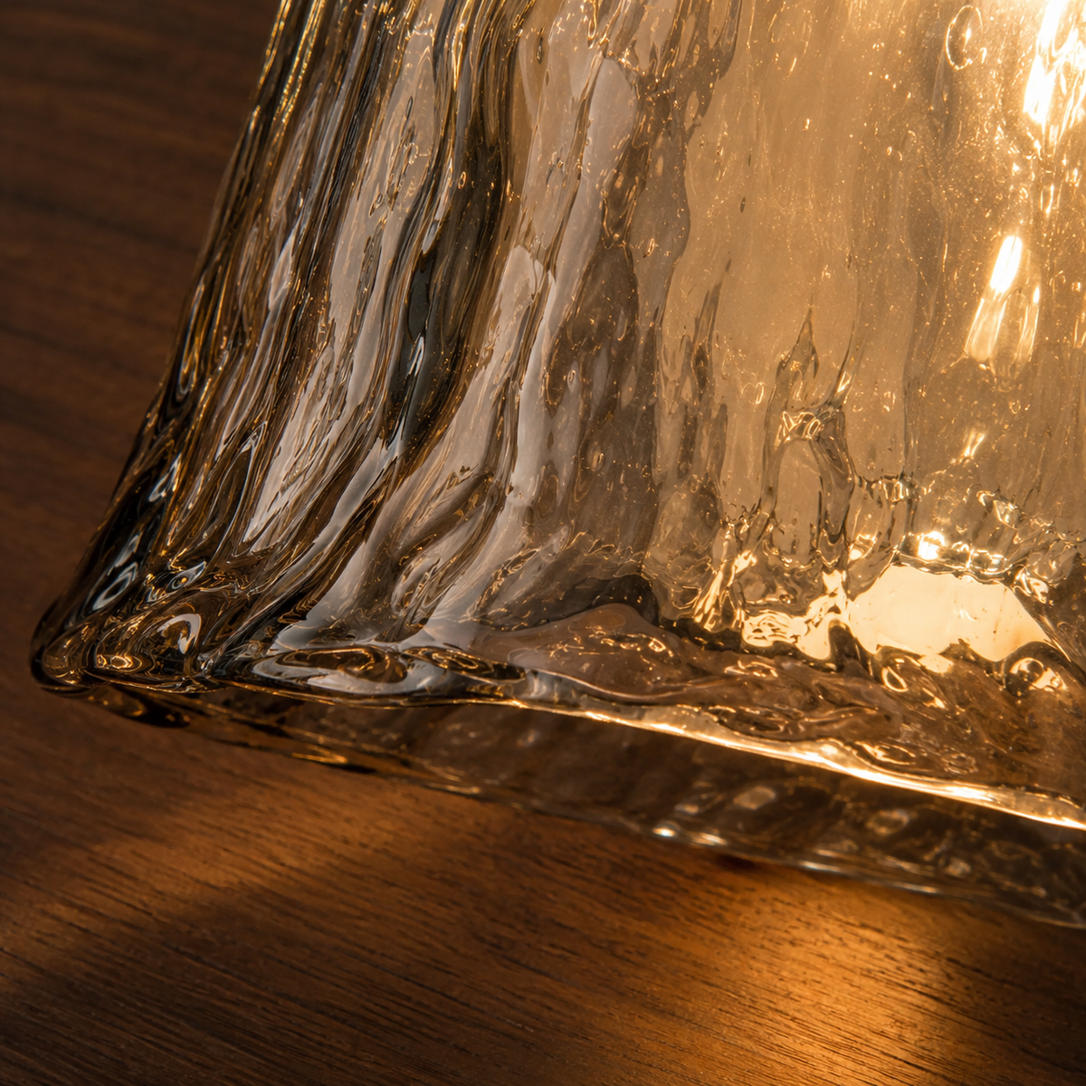Close-up of the warm amber glass on the Dvale wall light