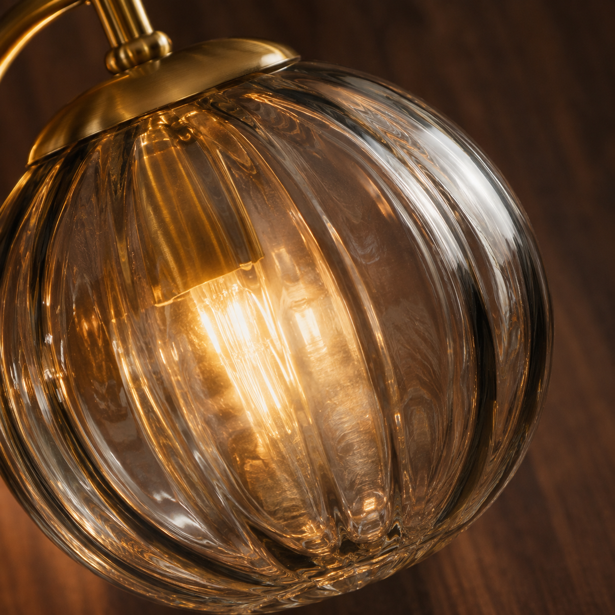 Lykta gold glass wall light styled in an elegant interior